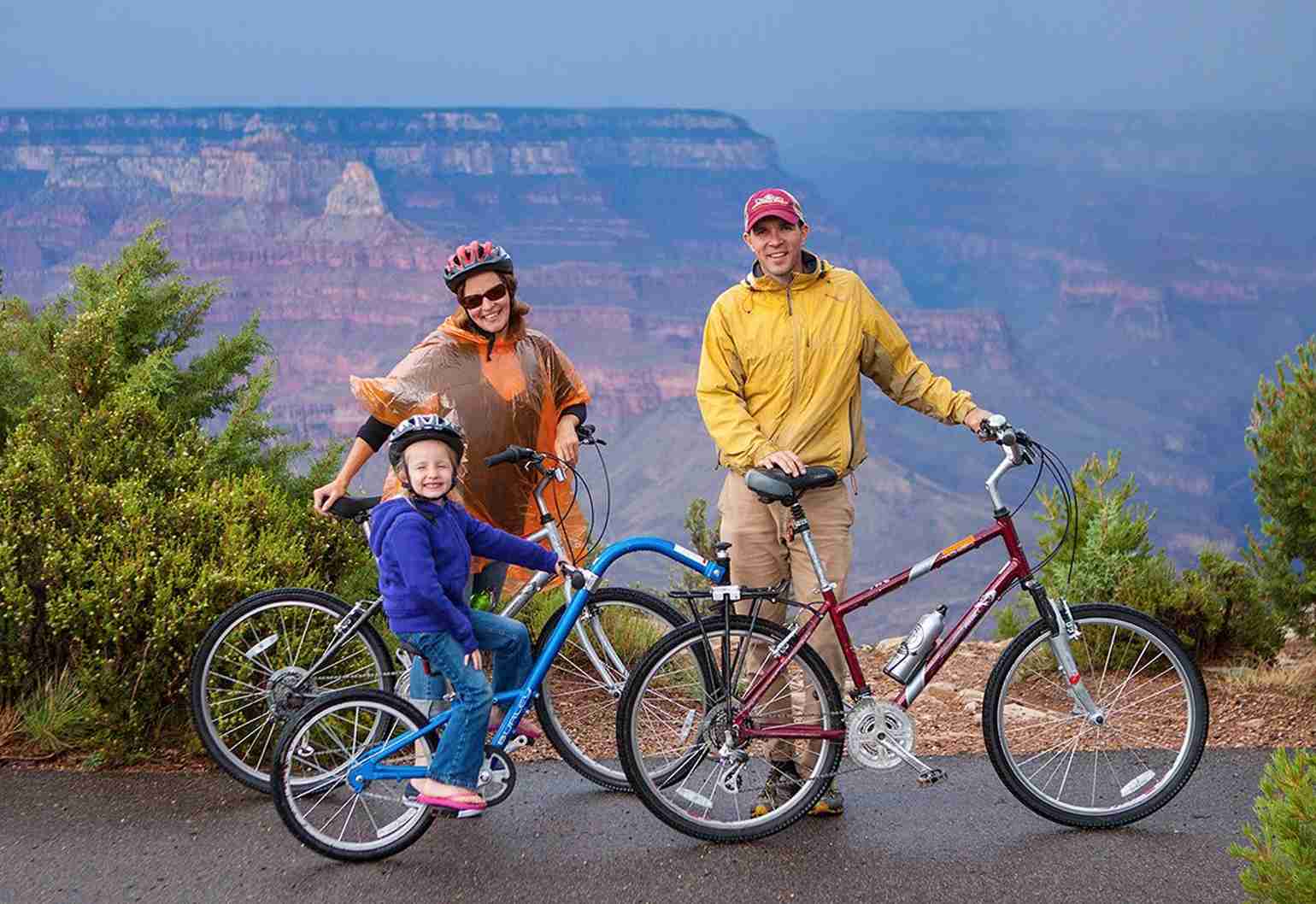 Family stopped for a photo overlooking the Grand Canyon